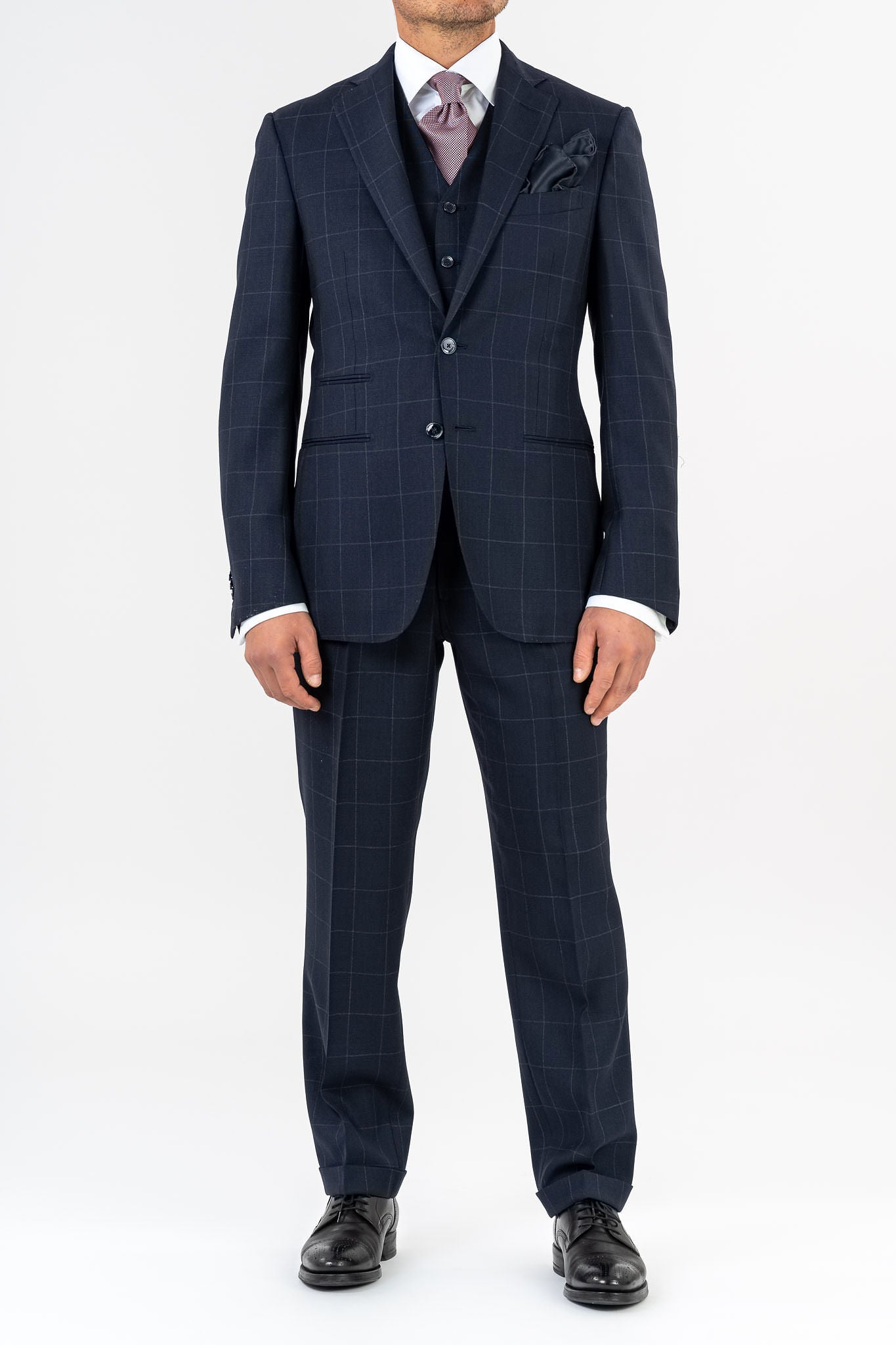 Three-piece suit, made with Loro Piana’s "Sopra Visso" wool, single-breasted,composed of a jacket with 2 buttons and welt pockets with a pocket for watch. Classic lapel and blue mother of pearl buttons. The elegant gilet has 5 buttons,the back has been made with elegant lining.The trousers have a regular waist and has only one dart,without loops with side buckle and predisposition for suspenders.Genuinely made in Italy by Sartoria dei Duchi