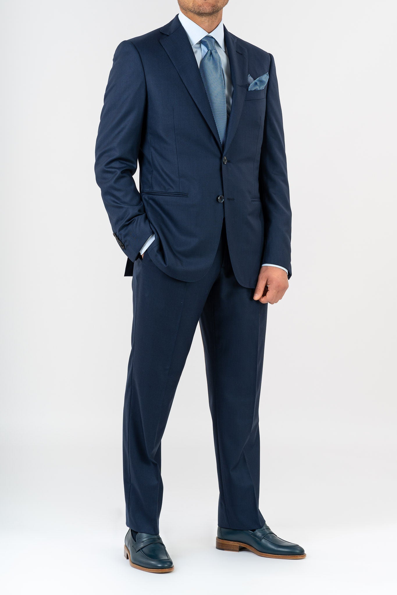 This Sartoria dei Duchi suit is realized in two pieces with the finest fabric of Loro Piana 100% wool &quot;Super 200s&quot;. This elegant and refined suit is composed of a jacket with 2 buttons with welt pockets without flaps. The pants has only one pence and four pockets in total between front and back. Regular rise. There are no belt loops as they are designed to be worn with suspenders. Buttonholes and dots of the jacket are exclusively handmade. 
