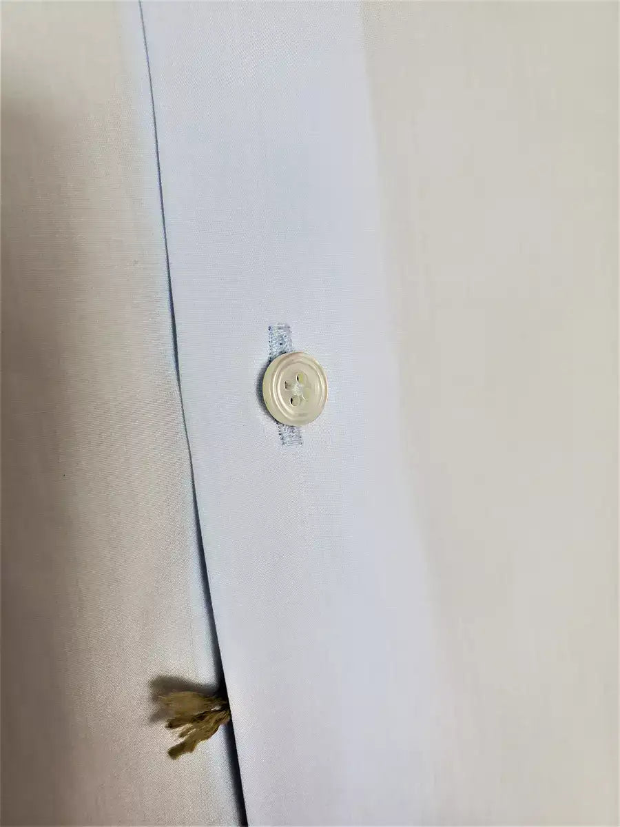 Classic light blue shirt in 100% pure Giza 45 cotton poplin by D&J Anderson. Italian collar w/ internal sticks. Double cuffs, height: 7 cm Hand-sewn VICTORIA FLAT WHITE PEARL buttons. 0.5 mm topstitch on the collar and cuffs - plain front - pleats on the back - bottom hem in margin. Mouches branded D&J Anderson. Fabric: 100% D&J Anderson "Popeline 240 warp", precious poplin made w/ the best cotton in the world (Egyptian cotton Giza 45) |Sartoria Dei Duchi-Atri