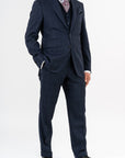 Three-piece suit, made with Loro Piana’s "Sopra Visso" wool, single-breasted,composed of a jacket with 2 buttons and welt pockets with a pocket for watch. Classic lapel and blue mother of pearl buttons. The elegant gilet has 5 buttons,the back has been made with elegant lining.The trousers have a regular waist and has only one dart,without loops with side buckle and predisposition for suspenders.Genuinely made in Italy by Sartoria dei Duchi