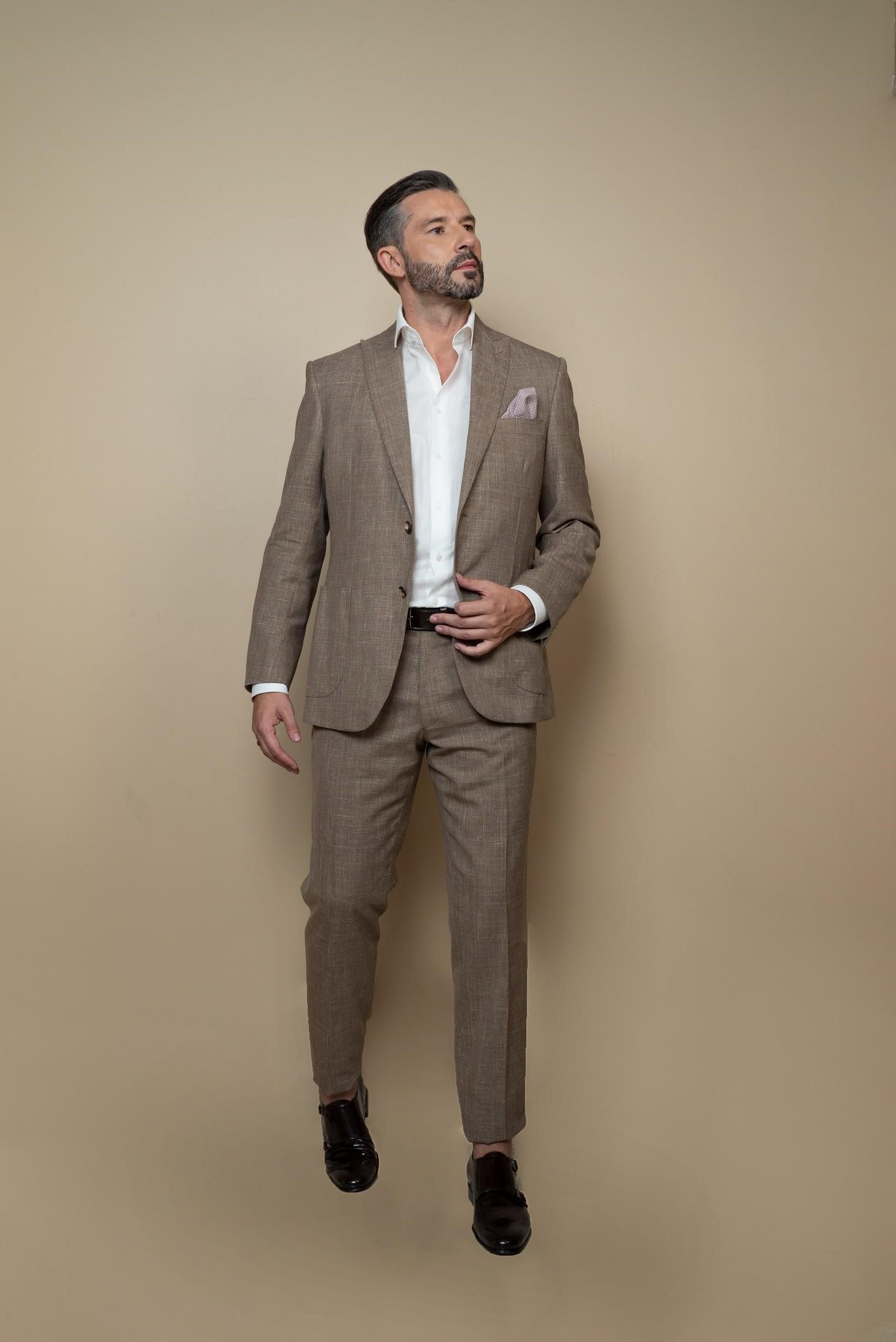 Single-breasted jacket with two buttons,classic peak  lapel,two side patch pockets,classic breast pocket, with SUMMERTIME fabric by Loro Piana textile,a light  and fresh fabric composed of wool, silk and linen,  perfect everyday summer occasion.Buttonholes,pockets, garments and all finishes are handmade by Italian tailors. This Italian tailored suit is extremely comfortable,and perfect for business occasions.Color: sand/taupeComposition: 71% wool, 15% silk, 14% linen.| Sartoria Dei Duchi-Atri