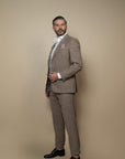 Single-breasted jacket with two buttons,classic peak  lapel,two side patch pockets,classic breast pocket, with SUMMERTIME fabric by Loro Piana textile,a light  and fresh fabric composed of wool, silk and linen,  perfect everyday summer occasion.Buttonholes,pockets, garments and all finishes are handmade by Italian tailors. This Italian tailored suit is extremely comfortable,and perfect for business occasions.Color: sand/taupeComposition: 71% wool, 15% silk, 14% linen.| Sartoria Dei Duchi-Atri