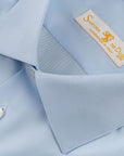 Our “HAMPTON SHIRT” is realized with a 140/2 cotton twill by Thomas Mason "Hampton", in light blue color. This long sleeve shirt is made with a semi French collar and a rounded wrist. The stitching is 5 mm and the buttons, applied by hand, are in mother of pearl Australia.  The fit is regular. - Sartoria Dei Duchi-Atri